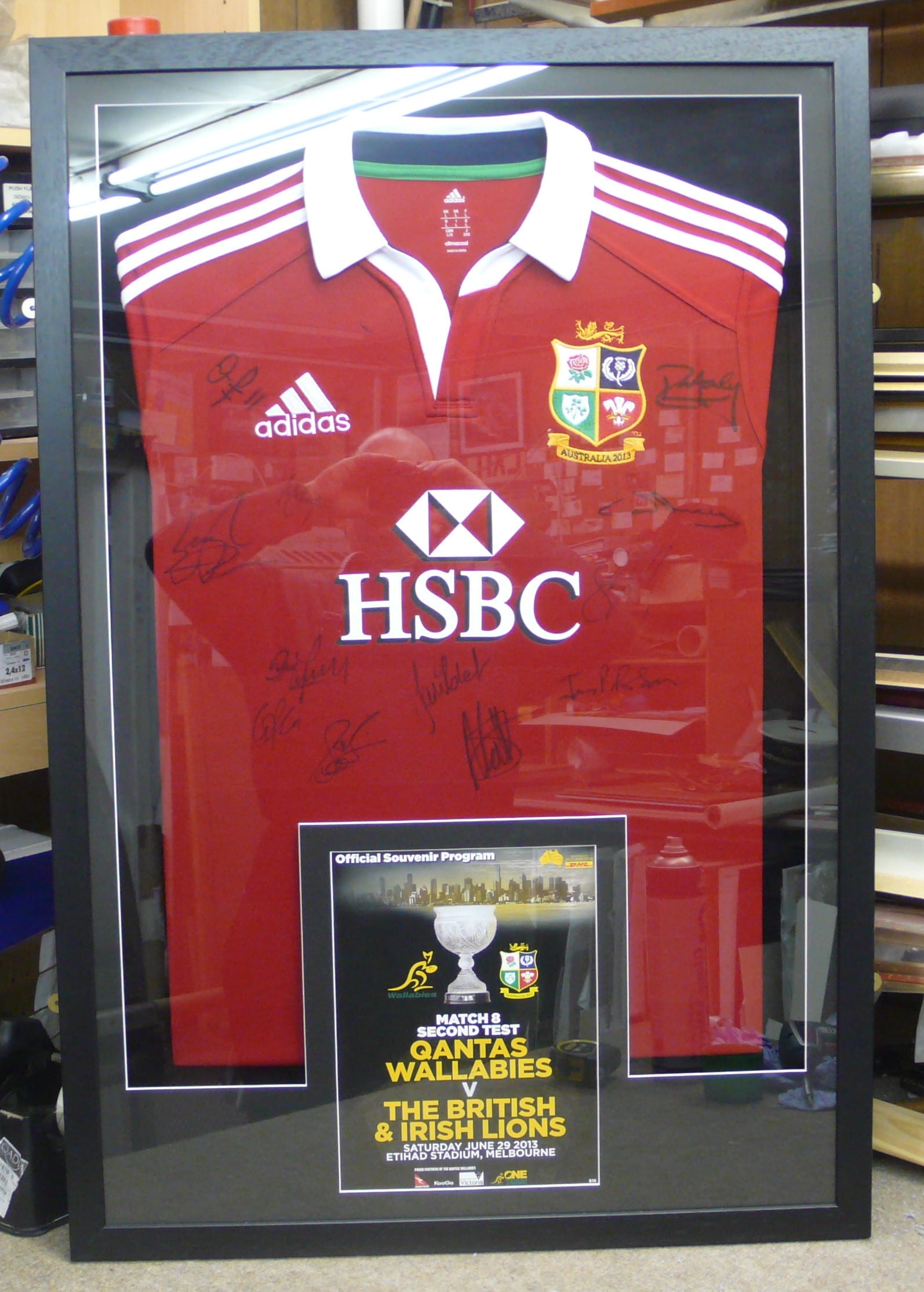 Framed Lion's Jersey with program