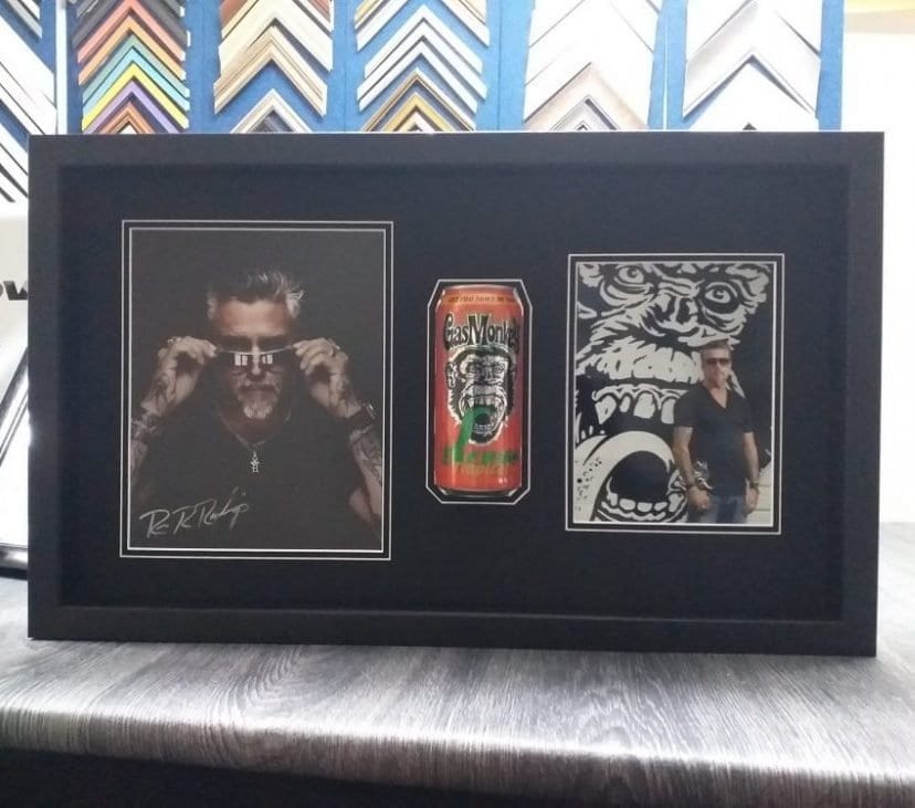 frame with two photos and a can