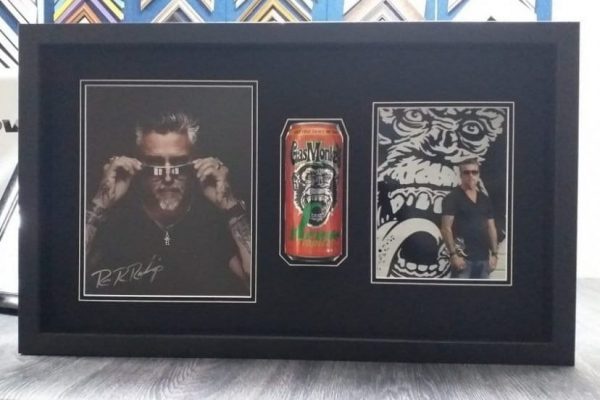 frame with two photos and a can